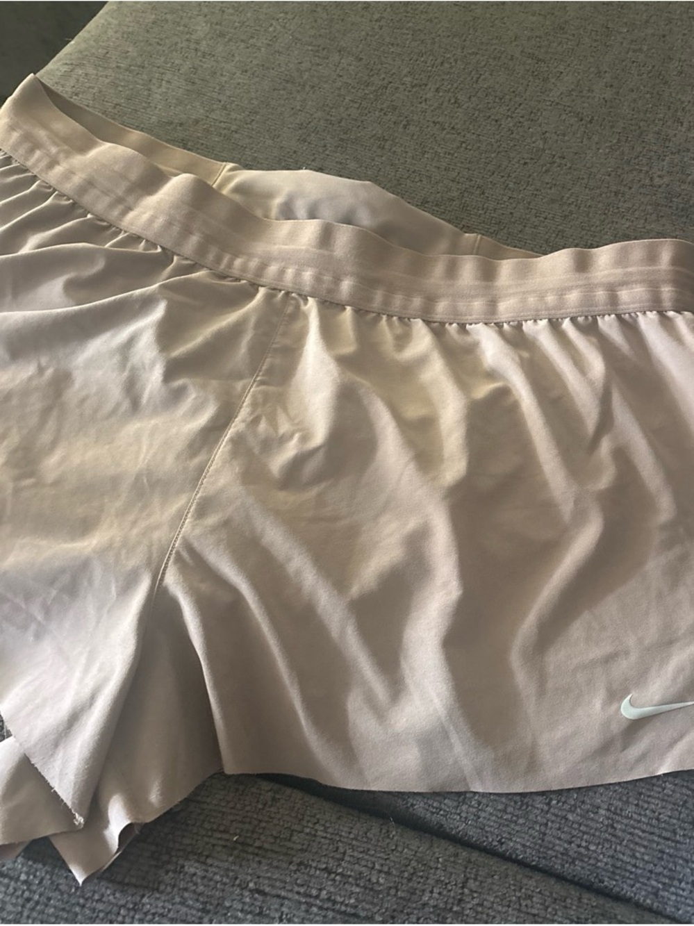 Nike Women's Pale Beige Athletic Shorts with Subtle Swoosh